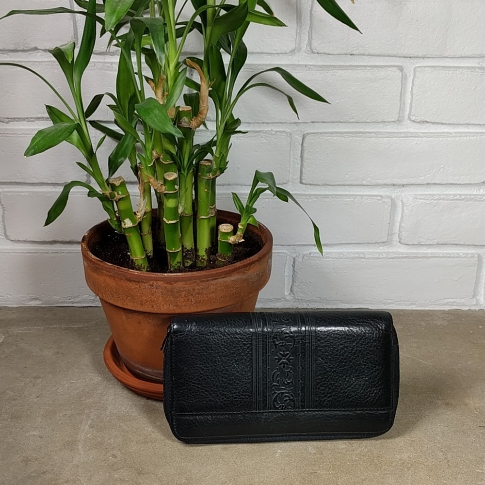 Amity leather wallet with moderate wear.